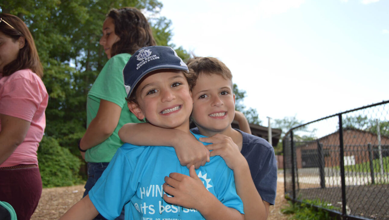 Boys hugging.