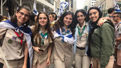 Group photo of girls in scout uniforms.