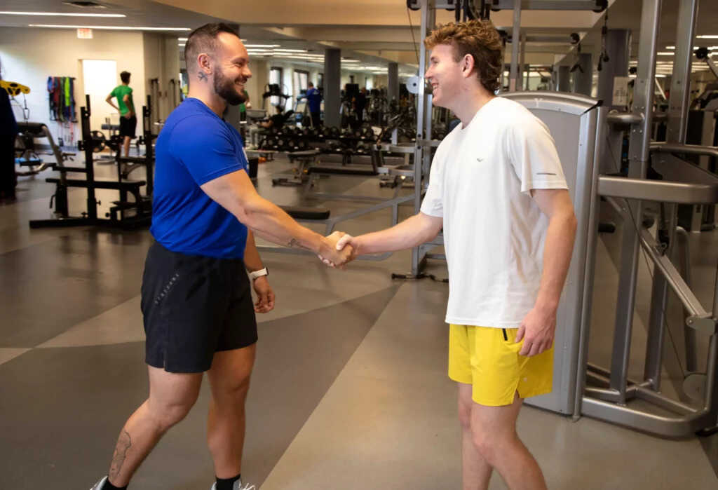 Personal Trainer welcoming a student at Kaplan JCC on the Palisades